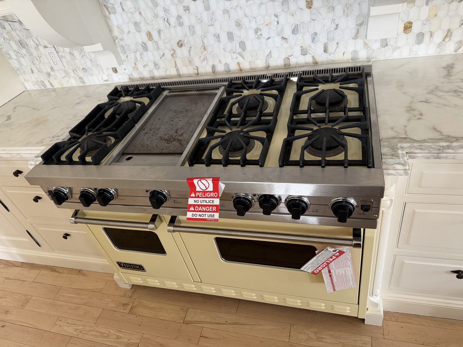 SoCalGas red danger tags on a 48-inch Viking Professional range in a Malibu kitchen before gas leak repair by A&Y Appliances